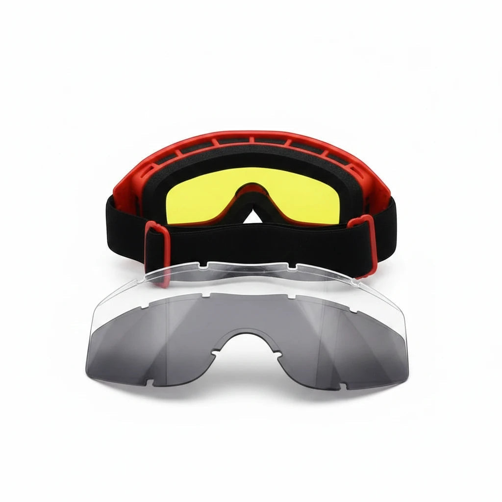 Gafas de seguridad GERF SAFETY ignífugas con montura roja, lente amarilla puesta y lentes de repuesto clara y negra.